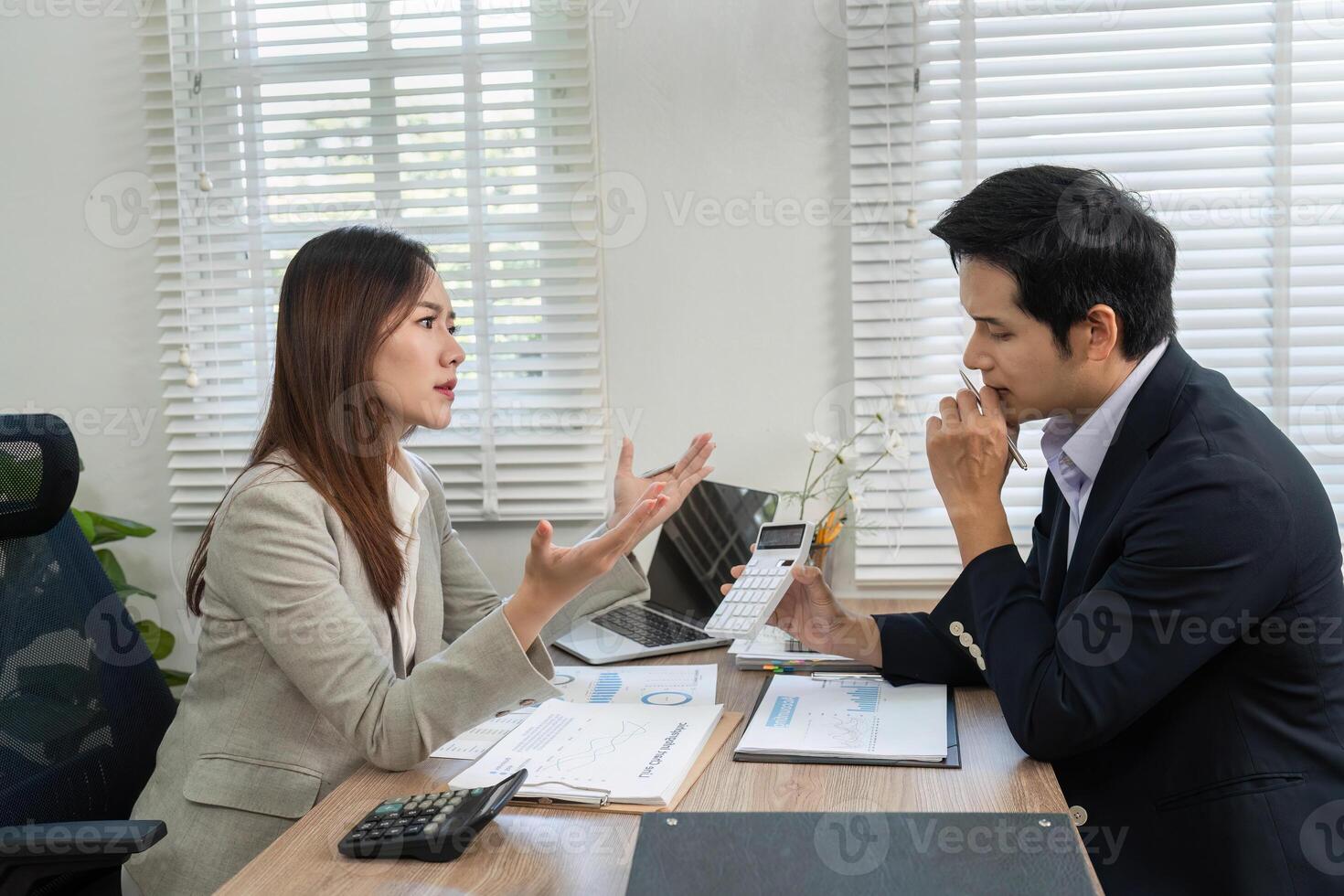Financial Consultation. Engaging discussion between a financial advisor and client in a modern office. photo