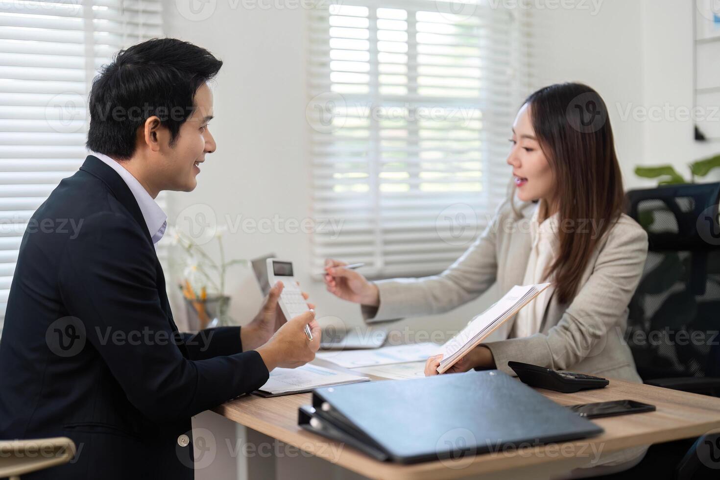 Financial Consultation. Professional meeting between financial advisor and client discussing investment strategies. photo