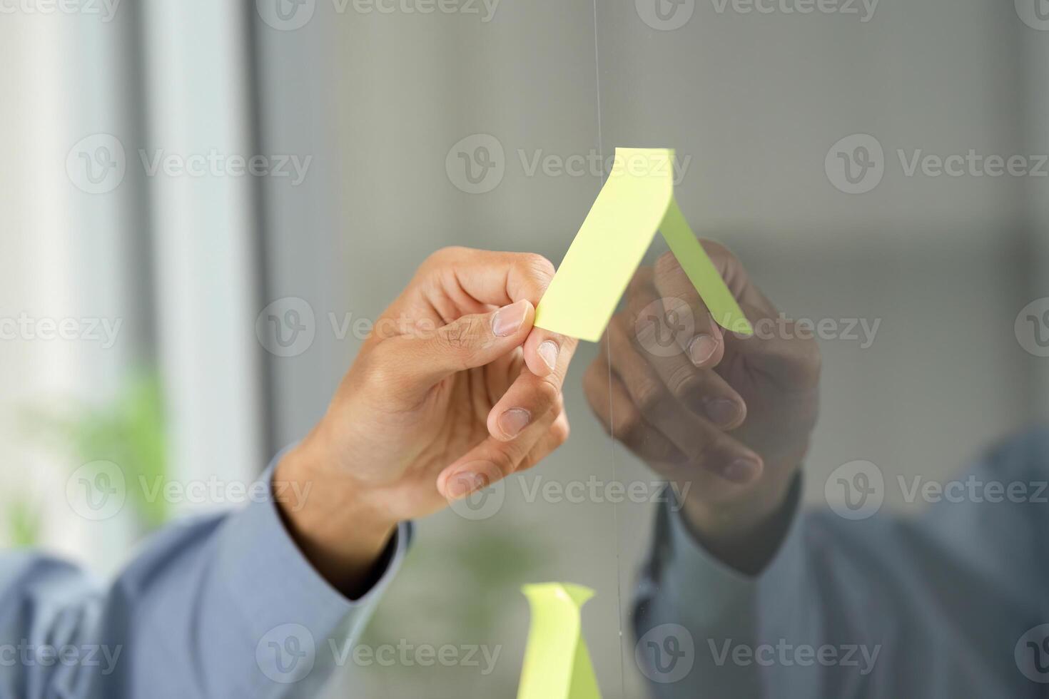 Office Productivity and Collaboration. Professional holding sticky notes for brainstorming. photo