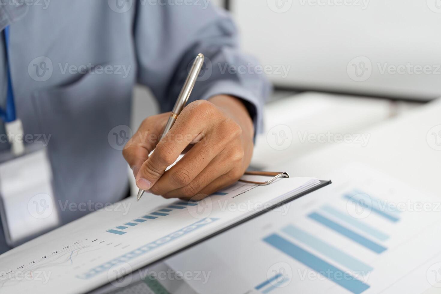 Remote Work and Digital Transformation. Professional writing on document with graphs. photo