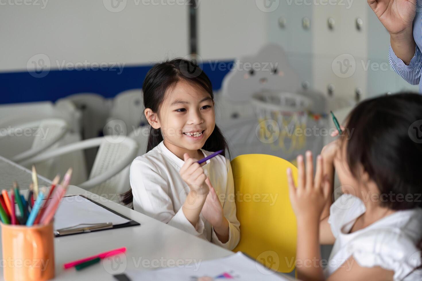 Back to School. Happy children sharing art supplies and engaging in creative play. photo
