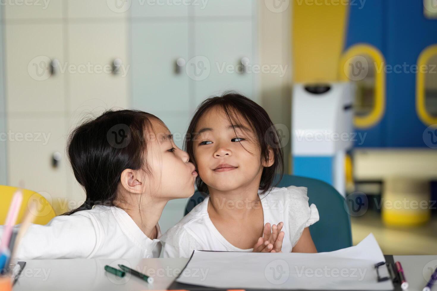 Back to School. Affectionate Moment Between Two Young Girls photo