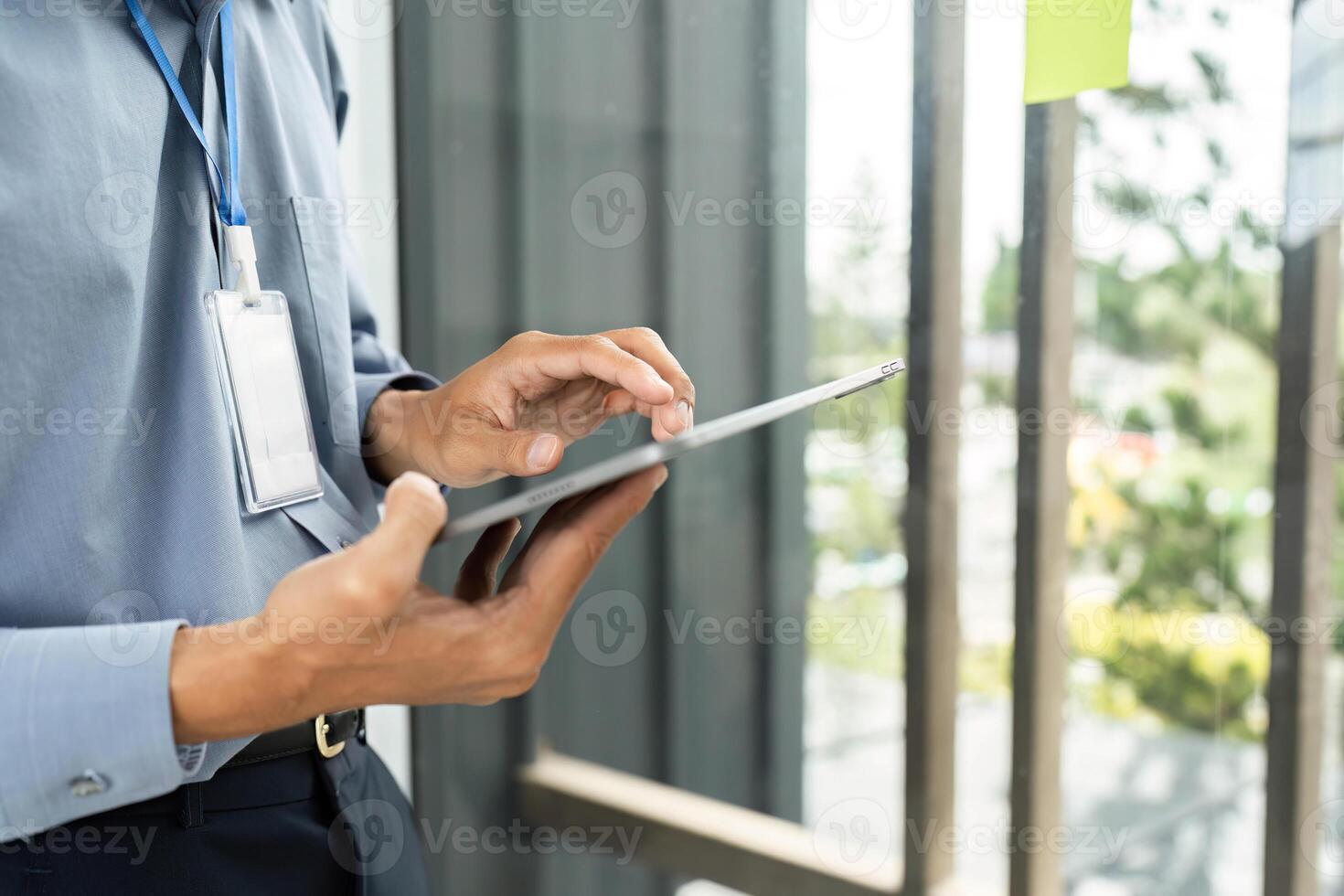 Digital Transformation in the Workplace. Professional man using tablet in modern office. photo
