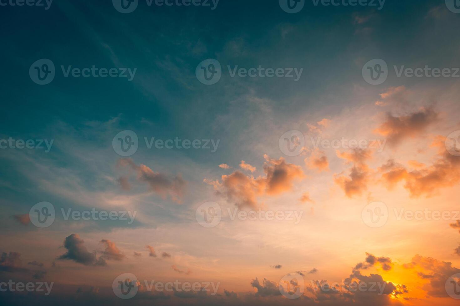 Breathtaking sunset sky filled with vibrant clouds casting golden light over calm waters and lush landscapes evoking a sense of peace tranquility nature perfect for serene escapes and reflection photo