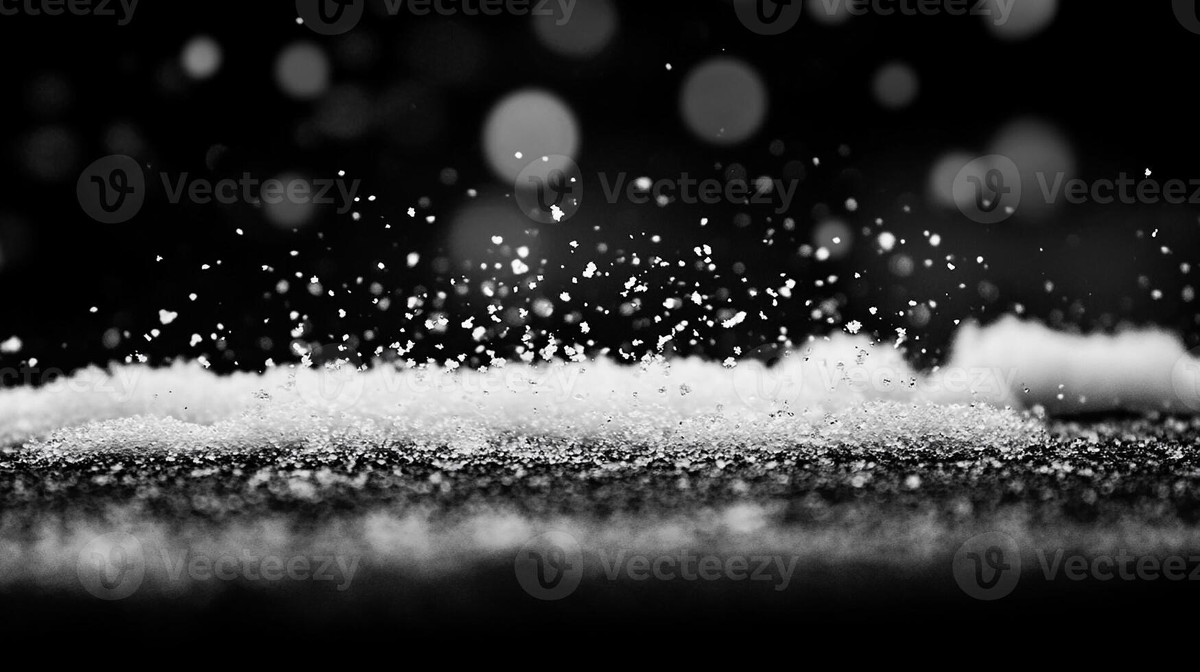 Snowflakes Floating Above a Frosty Black-and-White Background photo