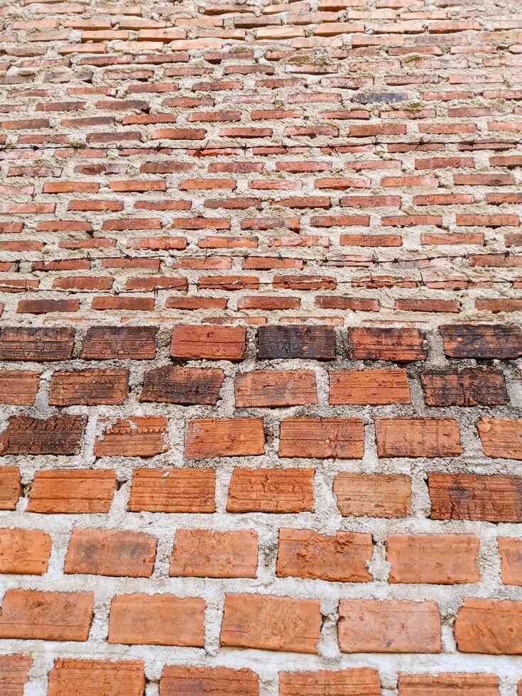 a brick wall with a few bricks on it photo