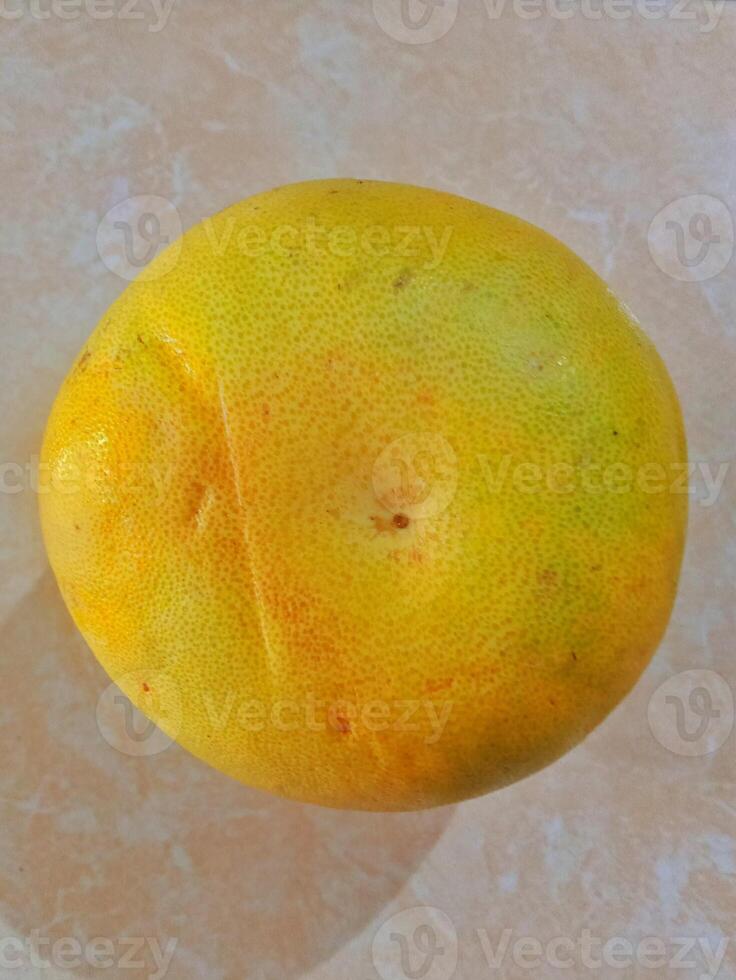 Pomelo, Jeruk Bali on a light surface. photo