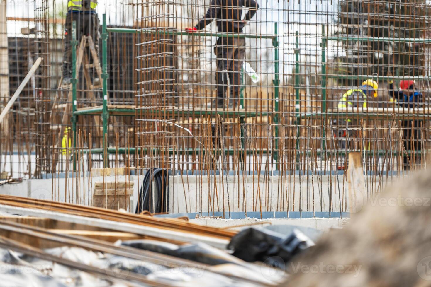 Construction Site Showing Workers Building a Concrete Structure photo