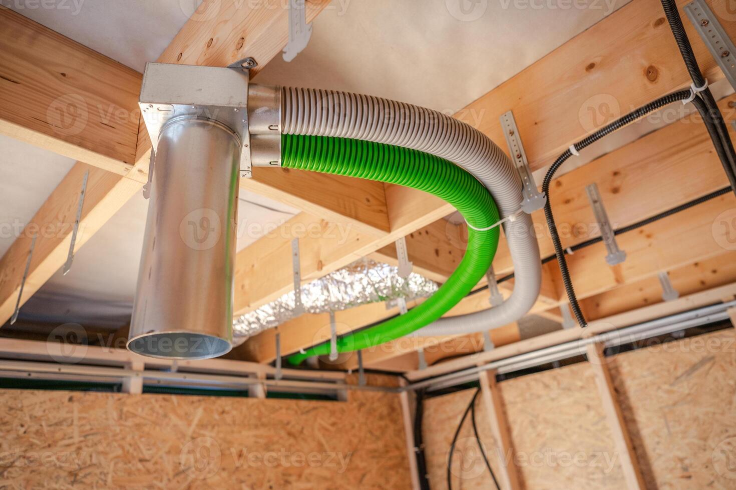 Ventilation System Installation in a Modern Home Under Construction photo