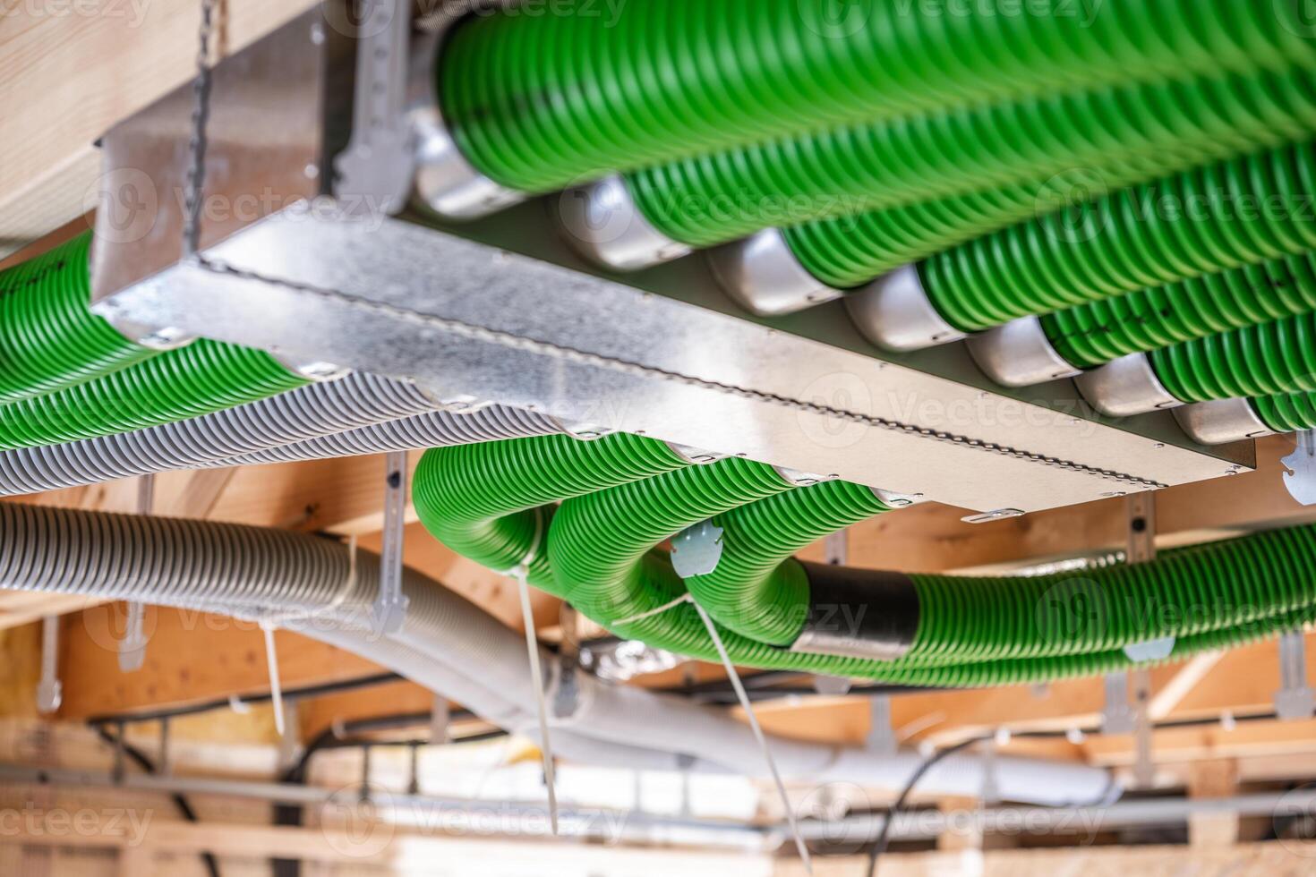 Colorful Ductwork Enhances Ventilation System in Modern Building Under Construction During Daylight Hours photo