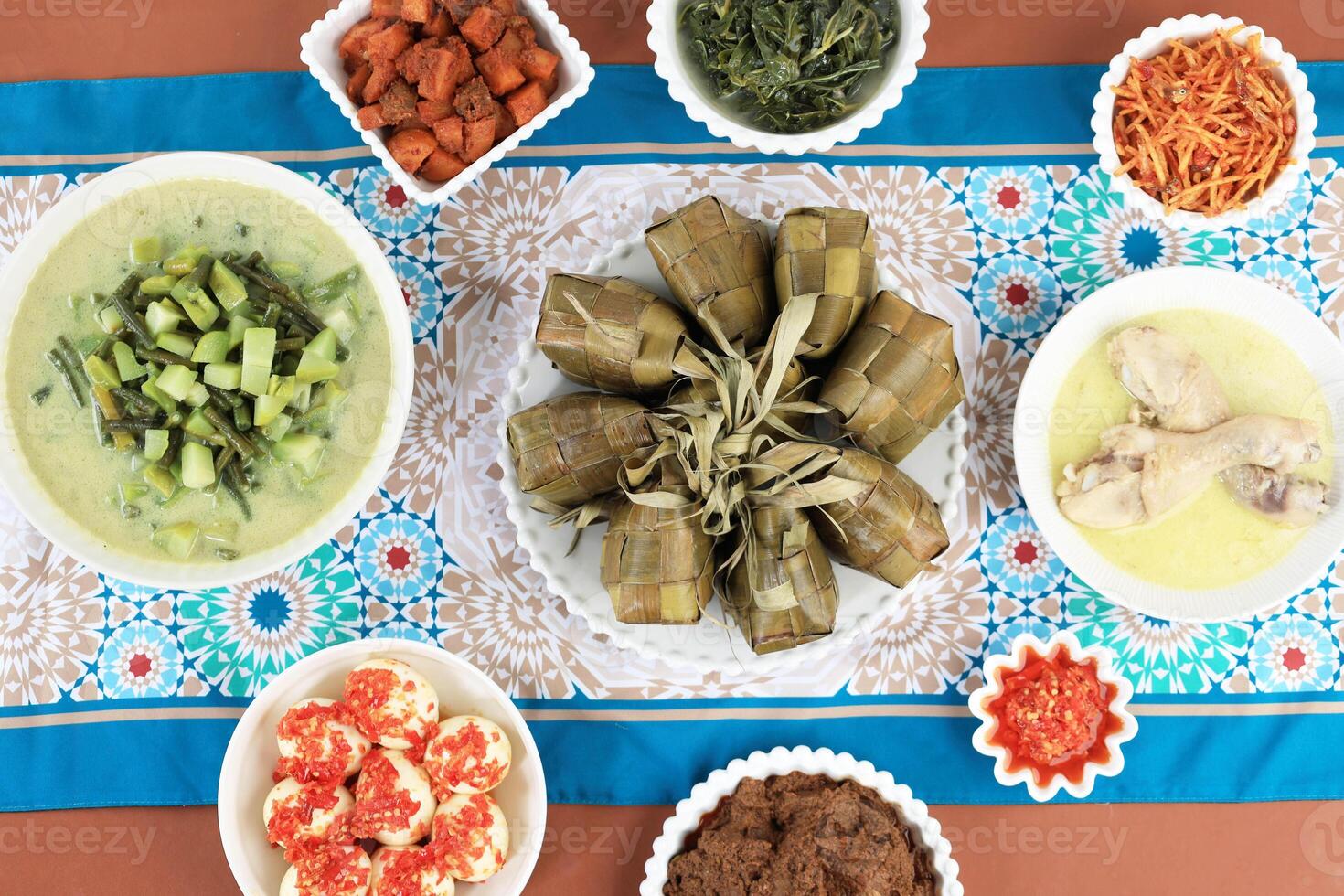 Top View Menu Ketupat Lebaran with Various Side Dish photo