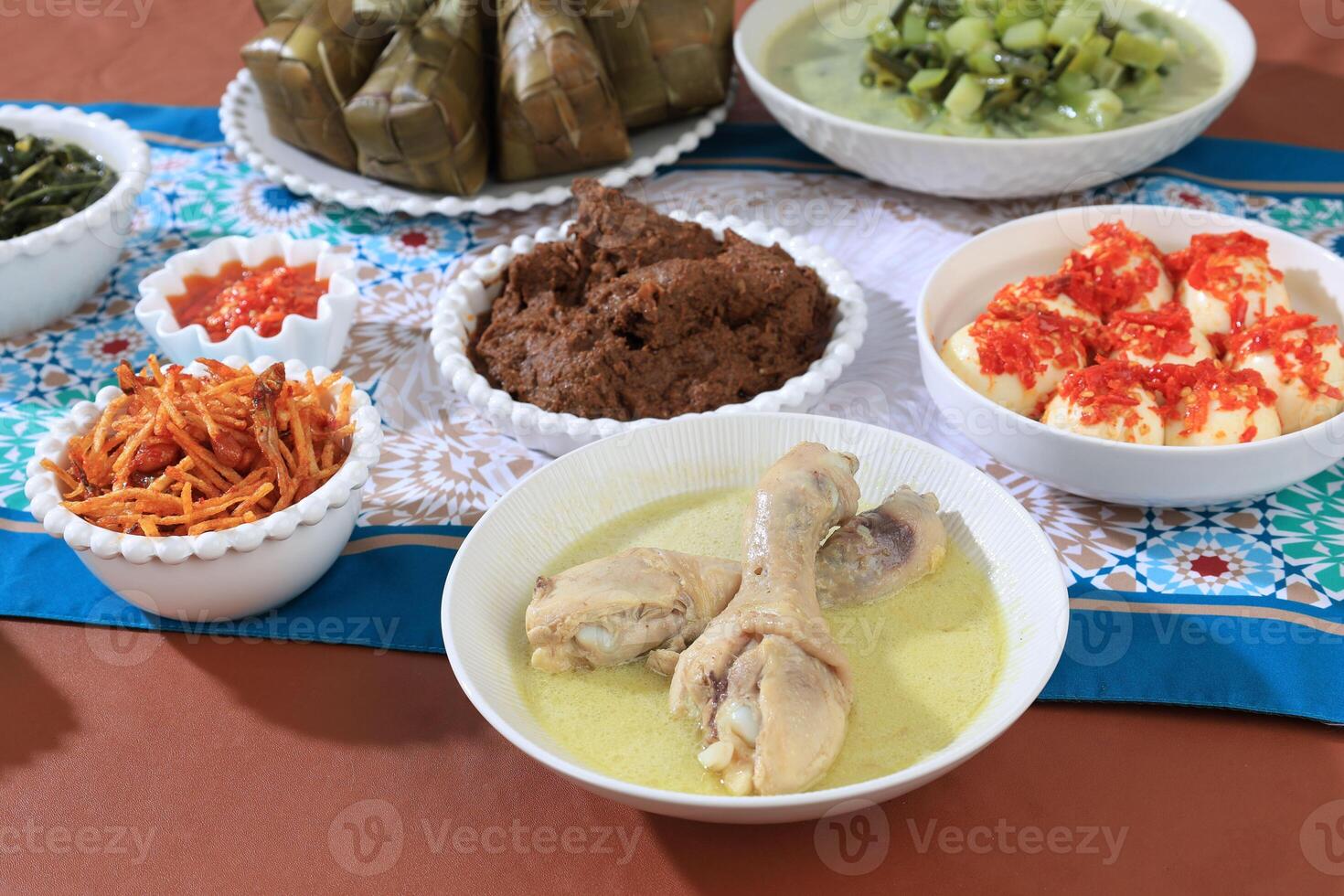 Opor Ayam, Ketupat, Kentang Mustofa, and Sambal Goreng Indonesian Traditional Food Served to Celebrate Eid al-Fitr photo