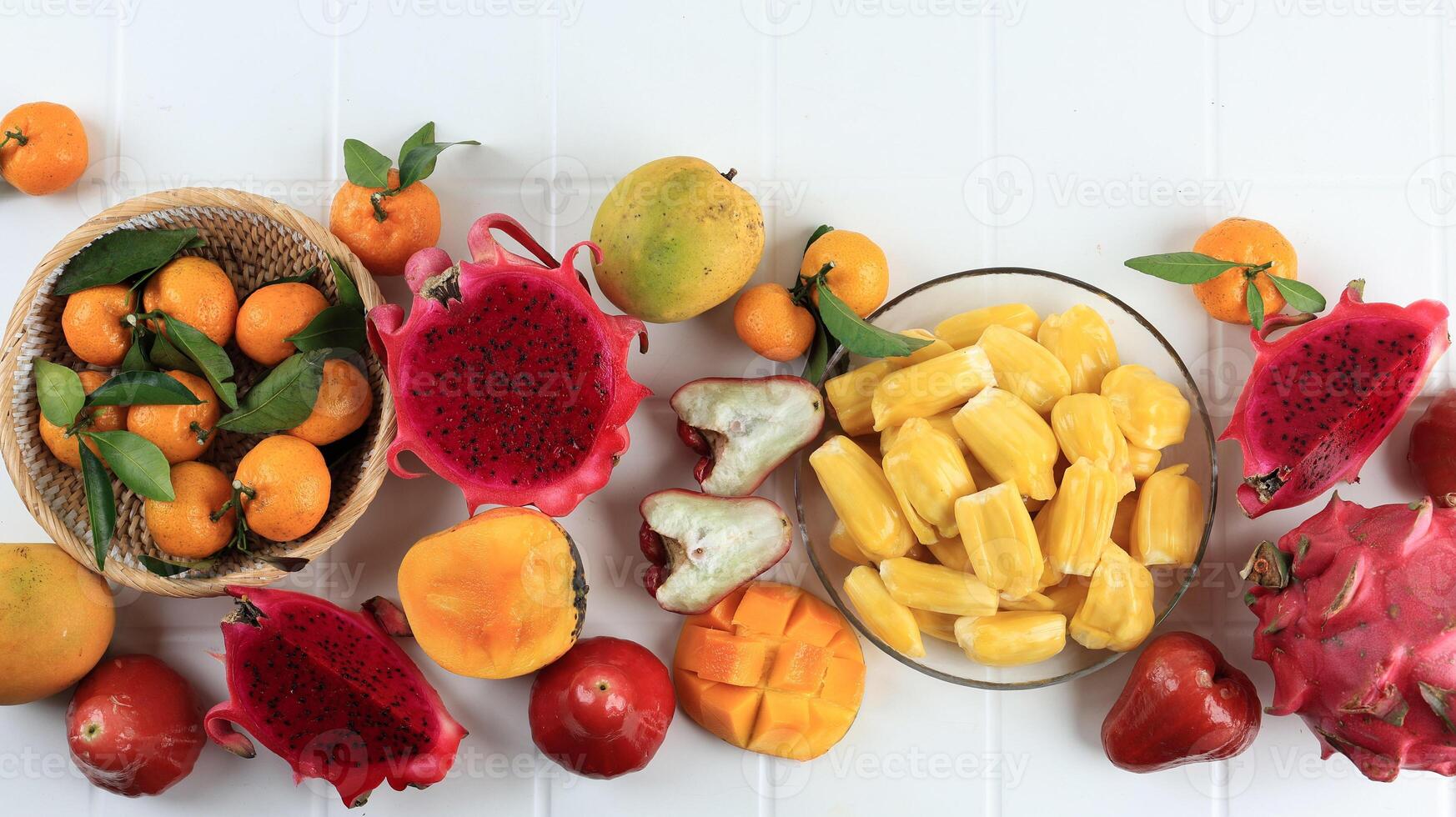 Top View Various Tropical Fruit, Mango, Dragon Fruit, Peelede jackfruit, Orange, and Water Guava photo