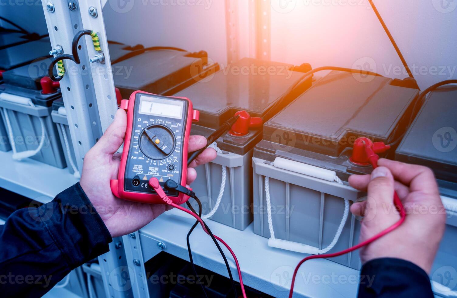 Electrical measurements with multimeter tester. Electrical background. photo