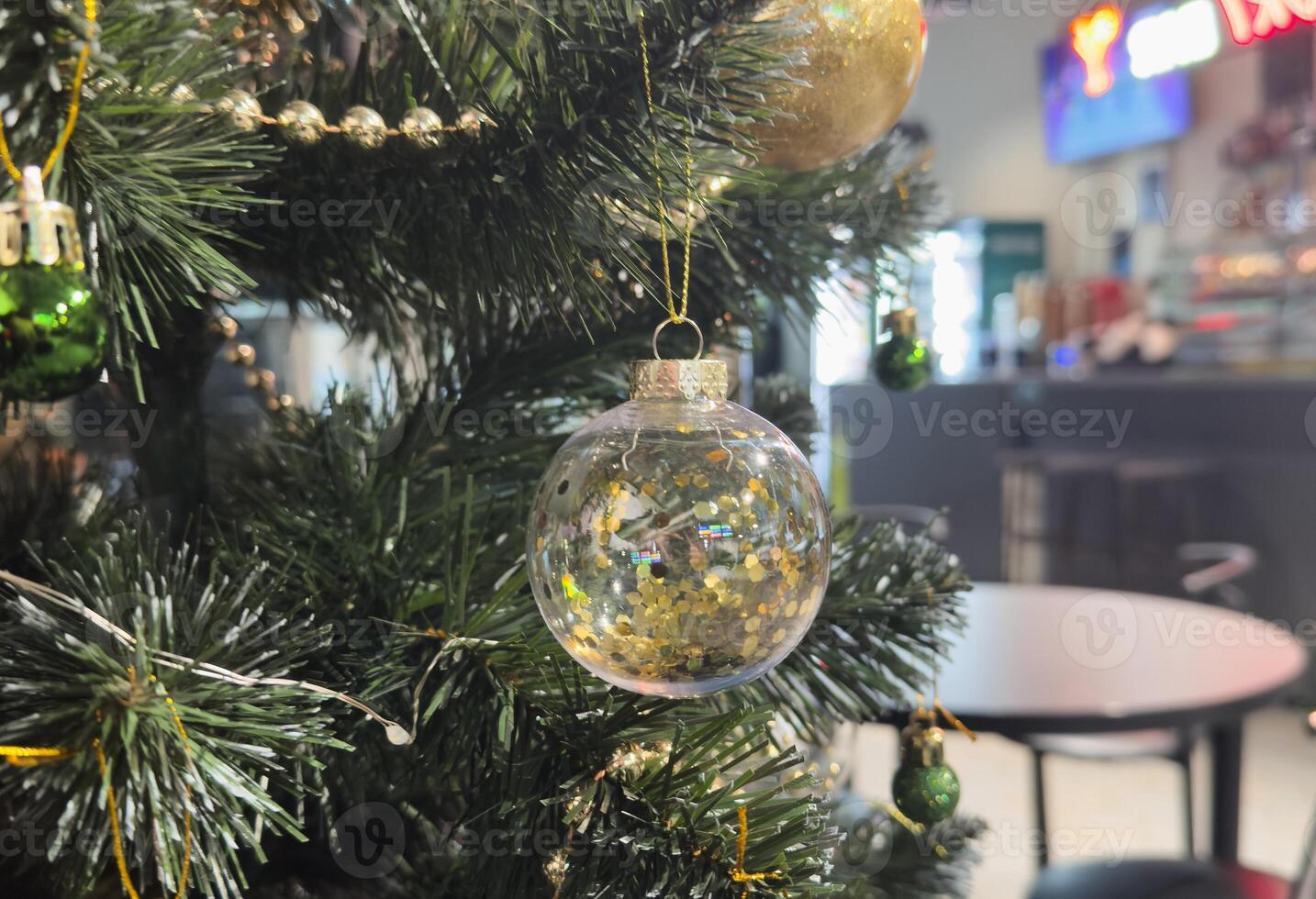 Close up of balls on christmas tree. Bokeh garlands in the background. New Year concept. photo