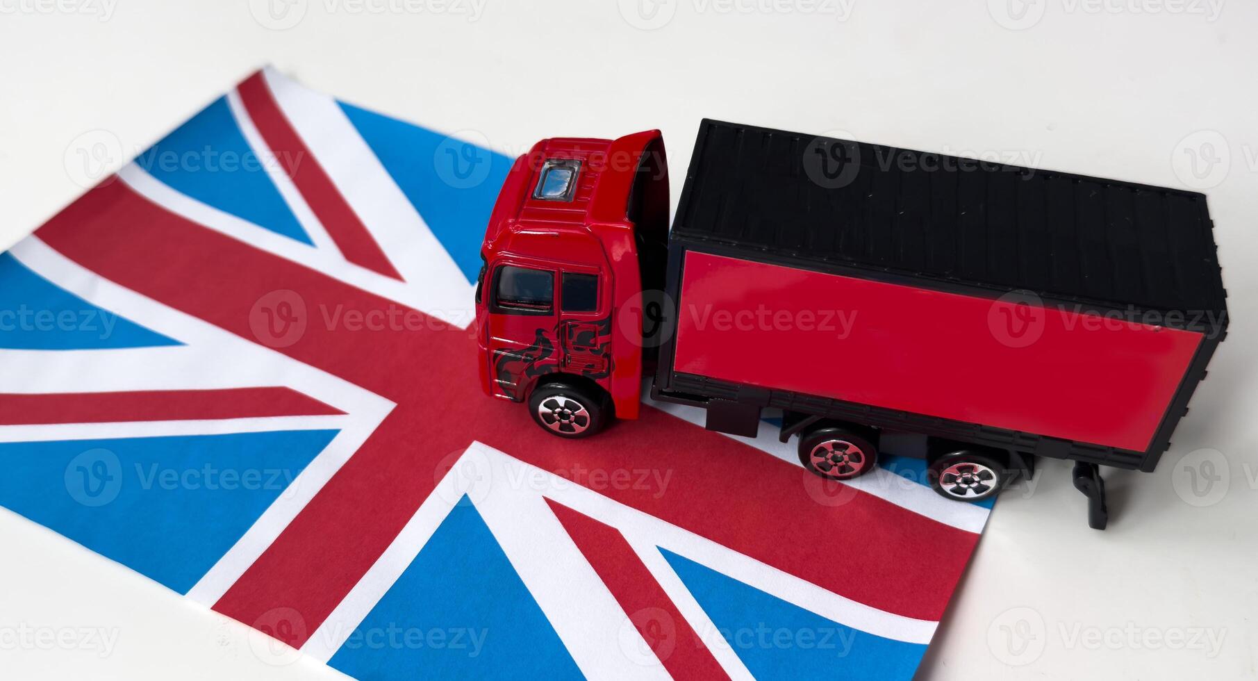 toy truck with national flag United Kingdom. The concept of export-import, transportation, national delivery of goods photo