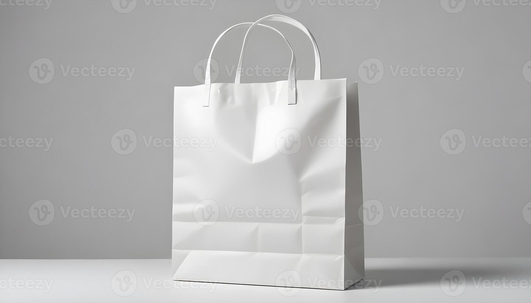 An isolated blank white shopping bag sits on a table, perfect for branding and marketing. photo
