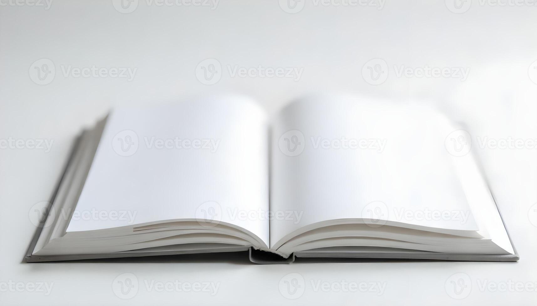 An open book with blank white pages ready for your content on a white table, ready to read. photo