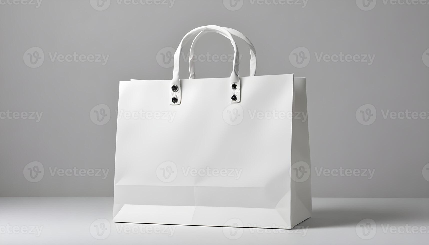A pristine white shopping bag stands on a reflective surface, perfect for product presentations. photo