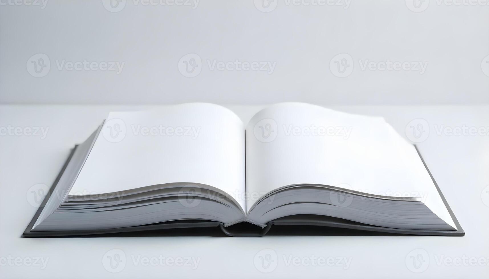 An open book with blank pages, ready for text, lies on a bright white surface. photo