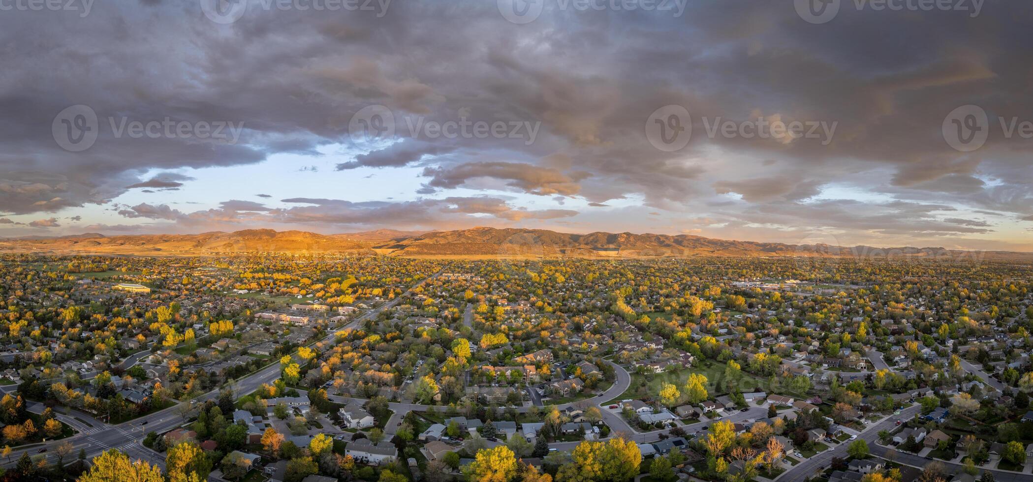 early morning with clouds over Fort Collins and foothills of Rocky Mountains in northern Colorado, springtime aerial view photo