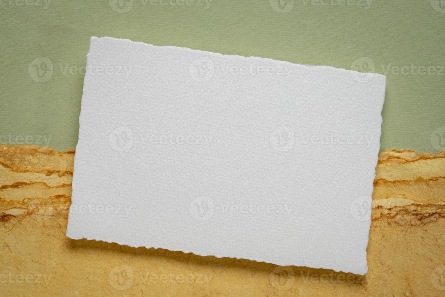 blank sheet of watercolor paper on a tan paper photo