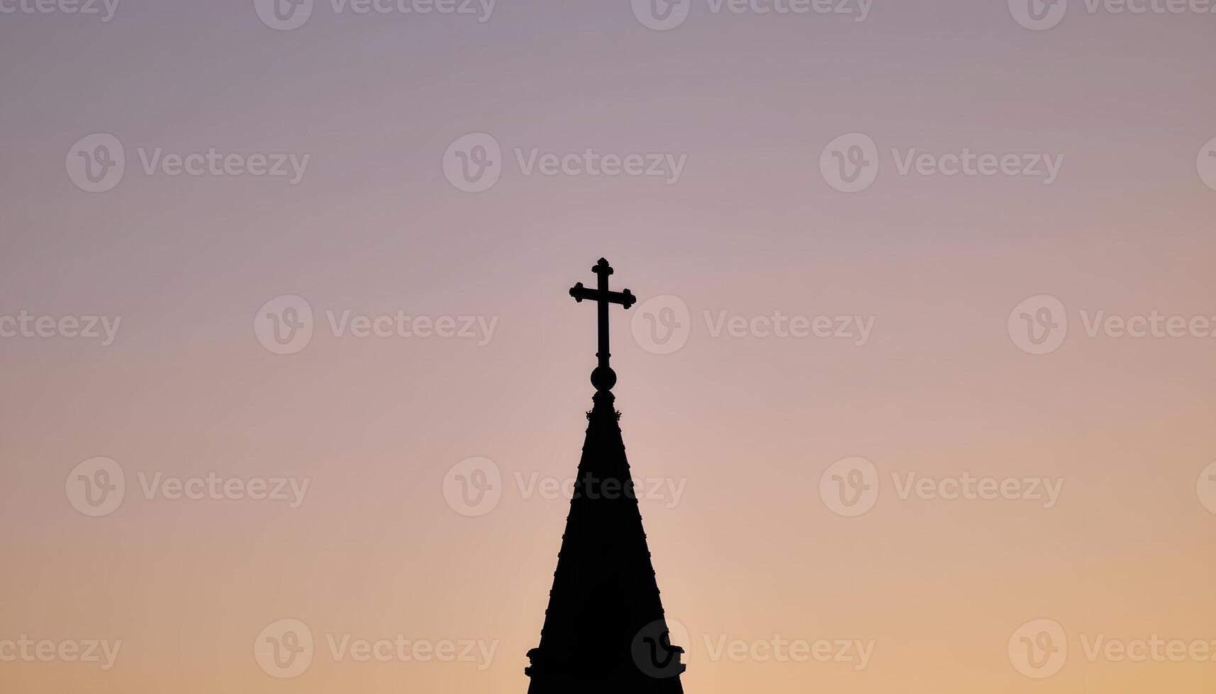 Silhouette of Church Steeple Cross at Sunset Spiritual Peace Religious Symbol photo
