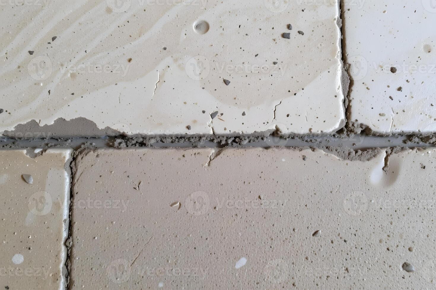 Close up of Cracked Tiles and Grout During Home Renovation or Construction photo