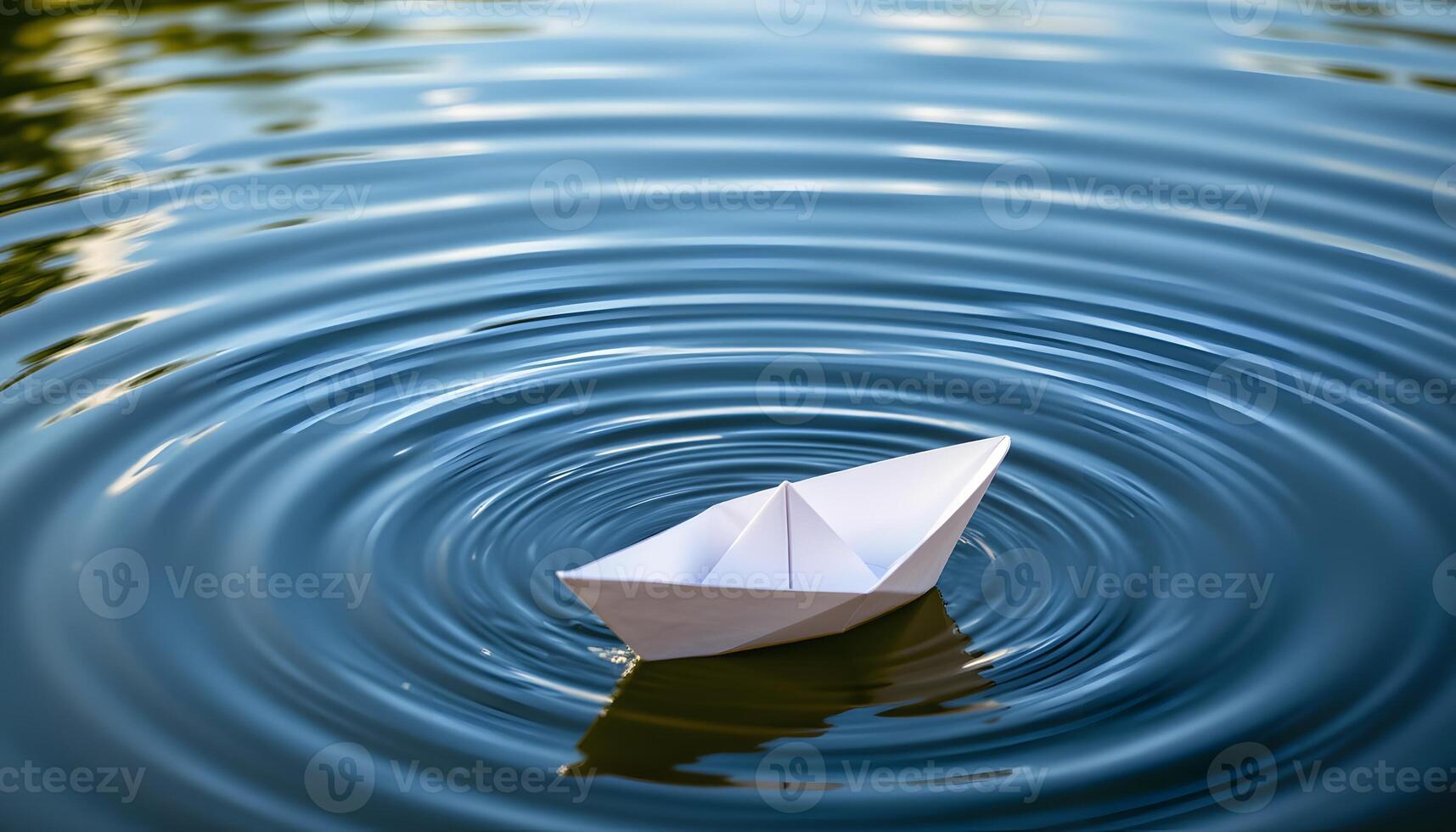 Serene Paper Boat Floating on Rippling Blue Water Tranquil Nature Scene photo