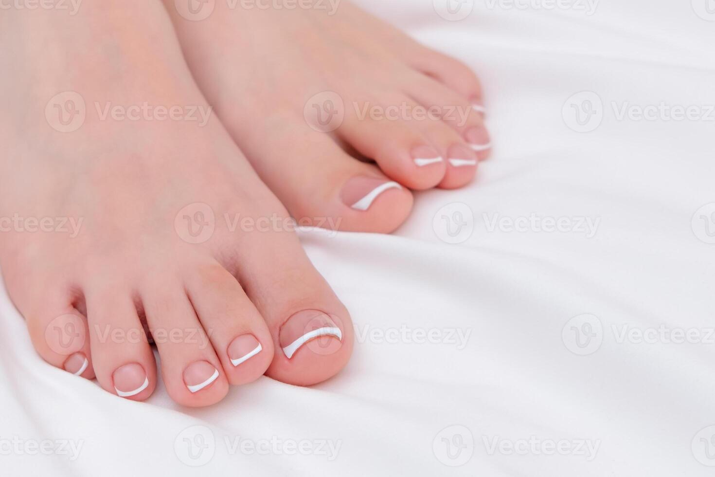 female feet with beautiful pedicure close-up. photo