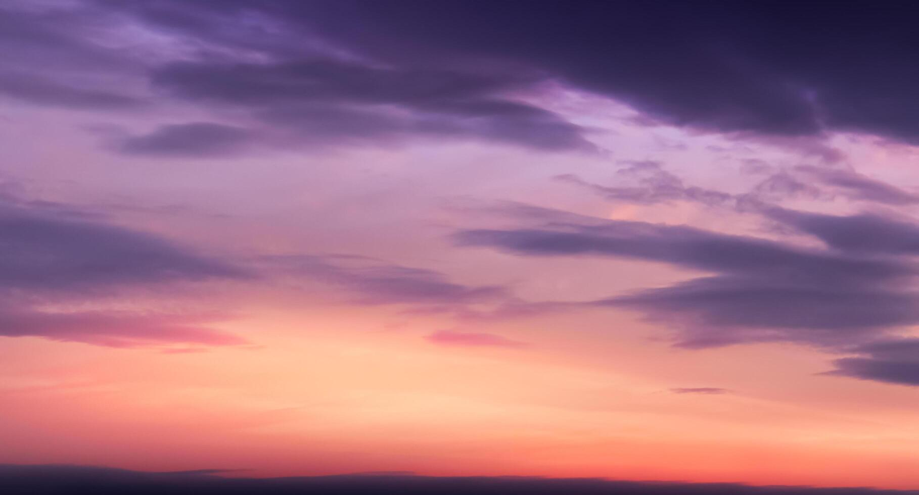 Sunset Sky,Cloud Background,Summer Sunrise over beach with sunlight reflection orange, pink, yellow, purple colour,Horizon Nature landscape dramatic golden hour of twilight dusk sky in evening Winter photo
