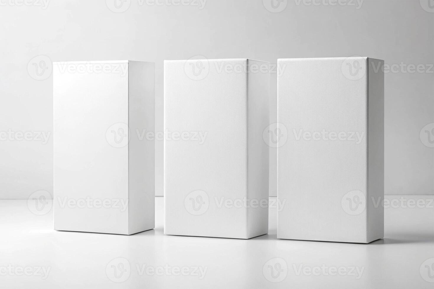 Three blank white rectangular software boxes standing side by side on a white surface against a white background - Minimalist Packaging Concept photo