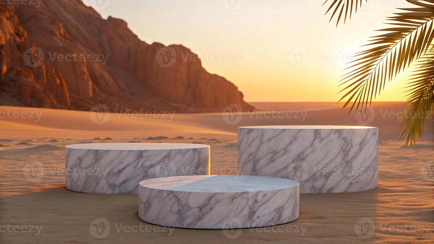 Three cylindrical marble structures with a smooth white-gray veined surface, placed on warm desert sand against rocky cliffs and a setting sun, with palm fronds on the side - Elegant Display Concept photo