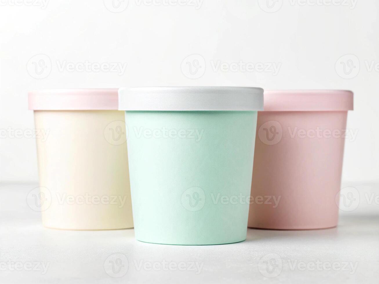 Pastel cylindrical containers with matching lids in soft yellow, mint, and pin - Minimalist Storage Concept photo