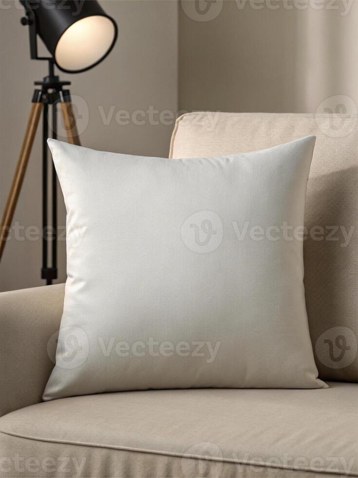 Beige cushion placed on a beige upholstered chair, complemented by a black and wooden tripod floor lamp with a warm glowing bulb - Modern Interior Concept photo