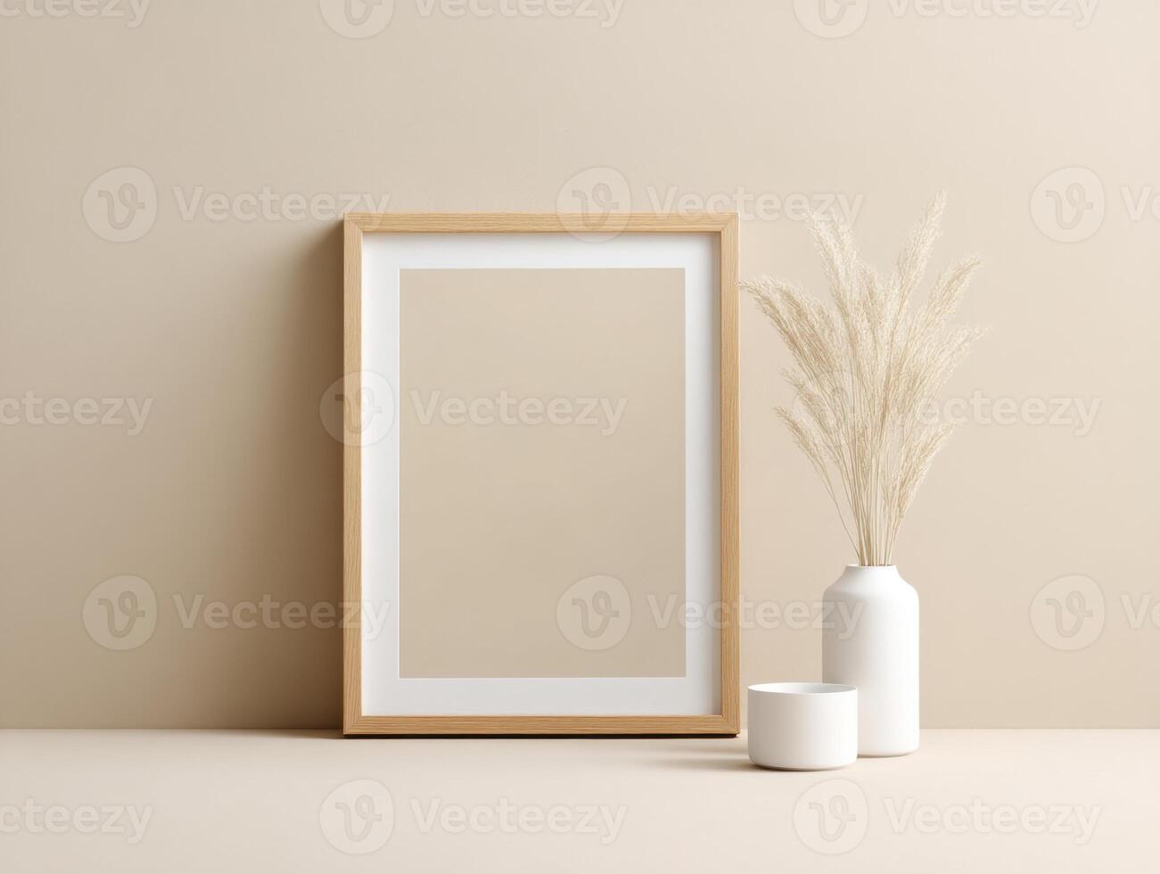 A minimalistic arrangement with a wooden picture frame, white vases, and dried pampas grass against a neutral, beige backdrop. photo