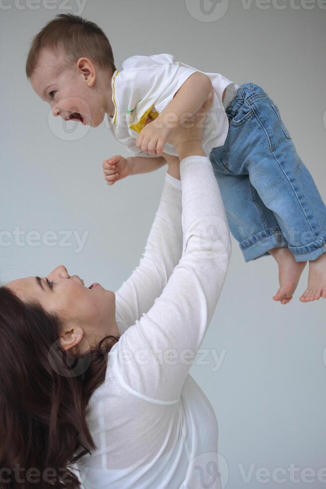 A young mother and her two-year-old son are spending time together photo