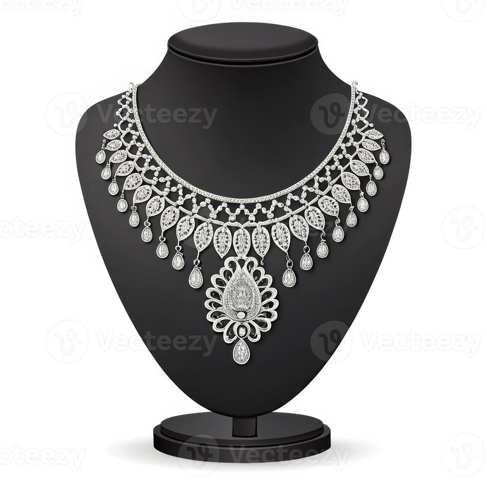 Elegant silver necklace with intricate design displayed on a black bust stand against a white background with copy space photo