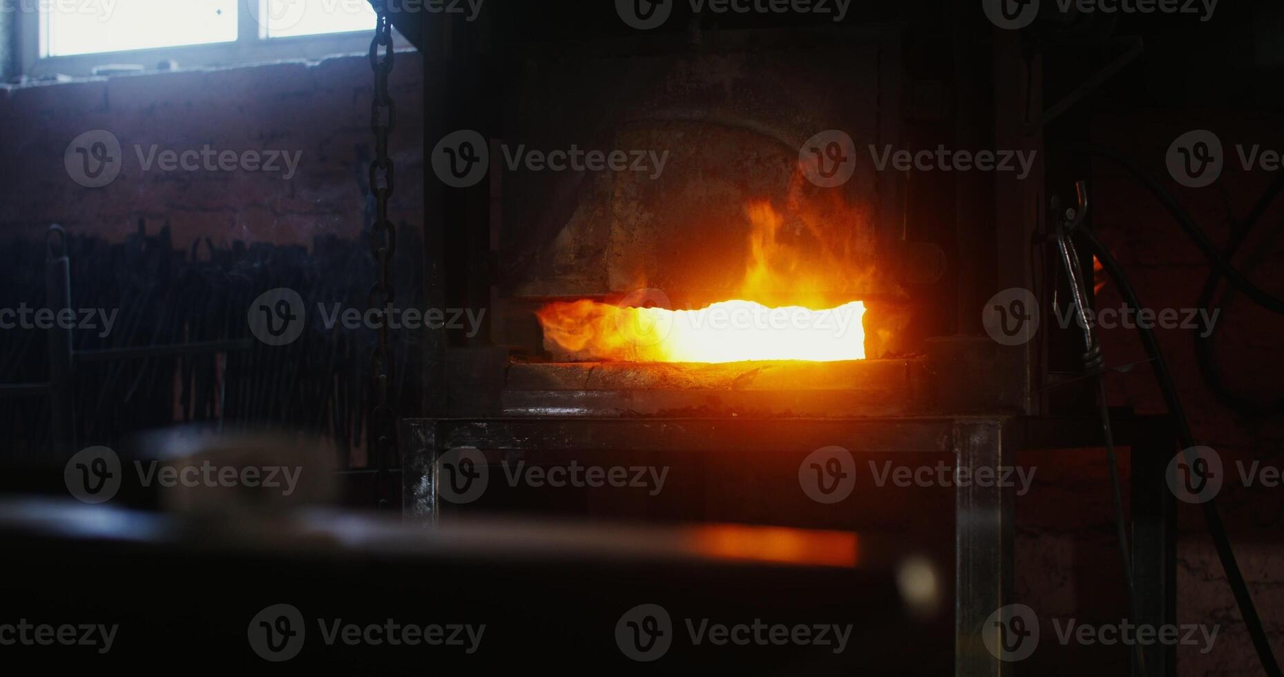 A furnace is being used to melt metal photo