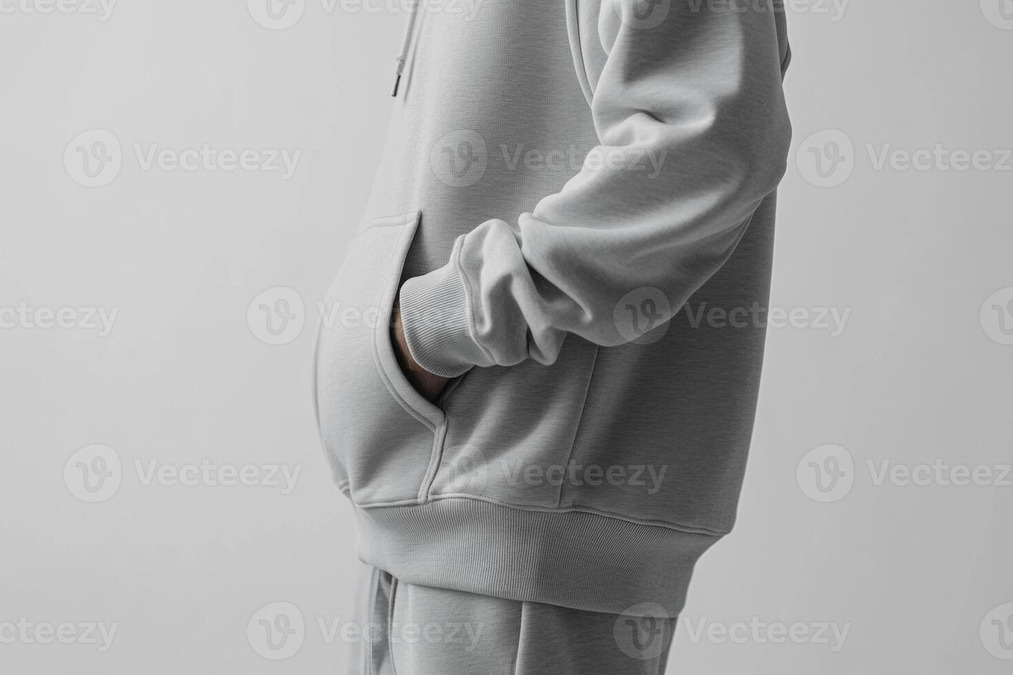 A man in a grey hoodie and sweatpants photo