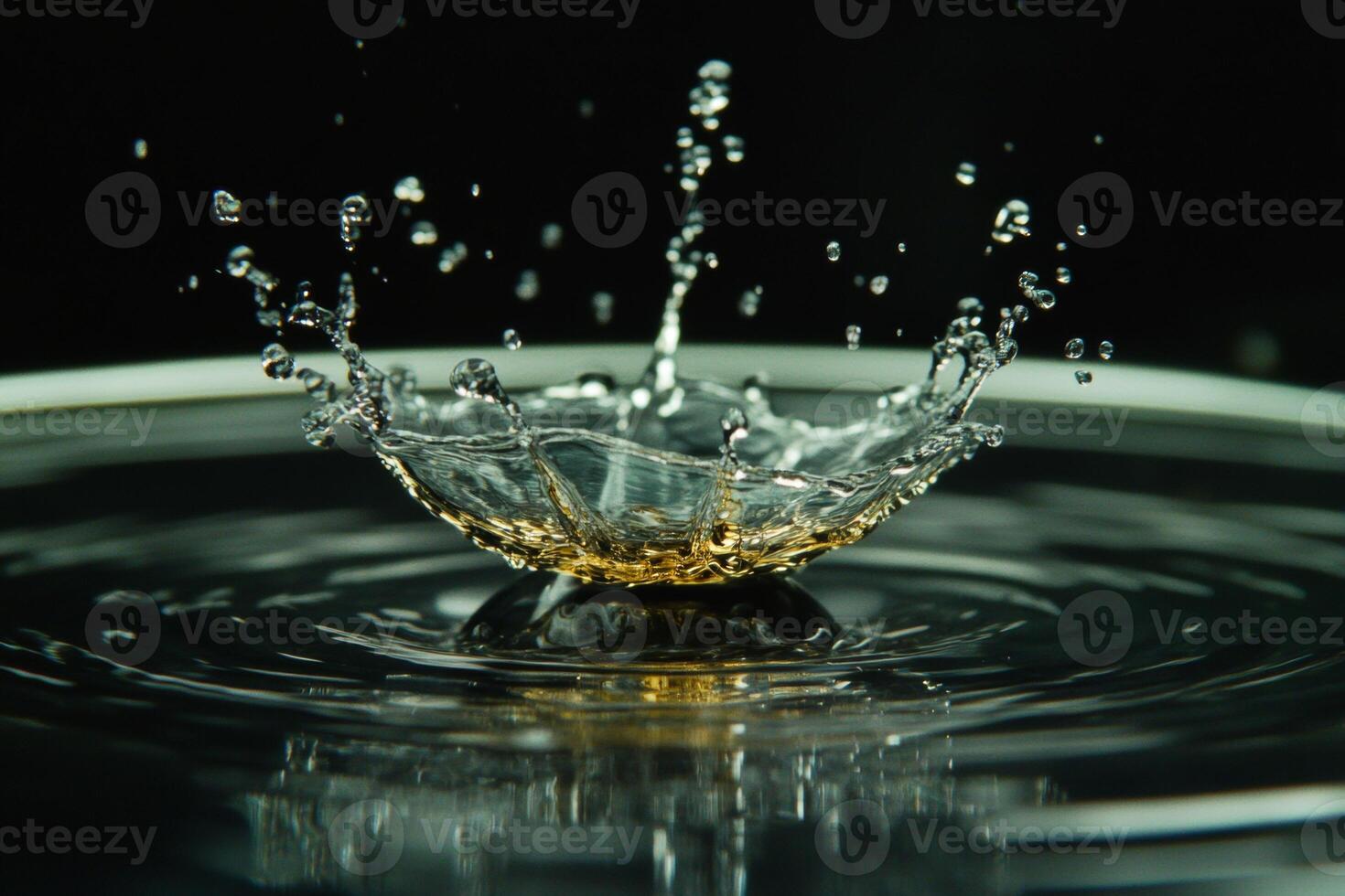 A drop of water splashing into the water photo