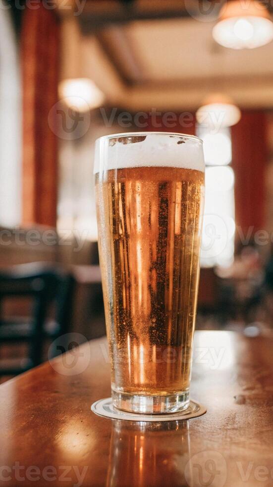 Golden Beer with Frothy Foam in a Classic Glass photo
