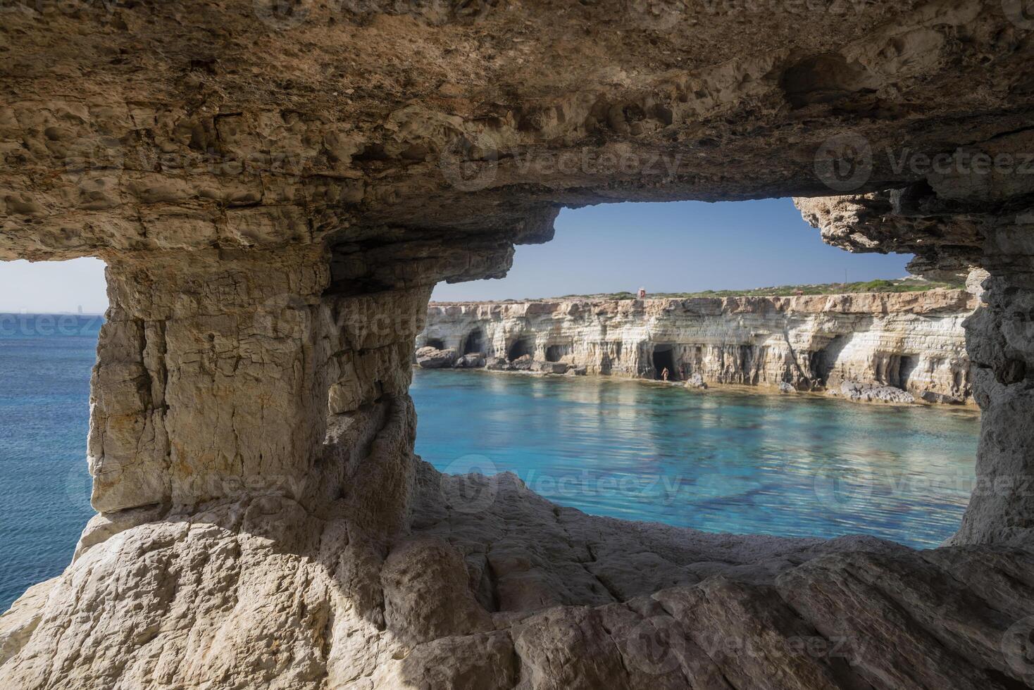Breathtaking coastal landscape of Cape Ayia Napa, also known as Cape Greco, located on the southeastern coast of Cyprus. Featuring dramatic limestone cliffs, crystal-clear turquoise waters photo