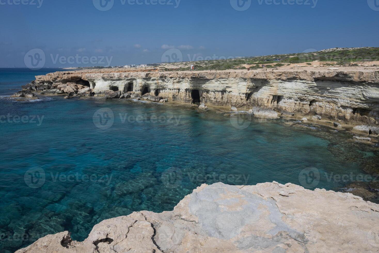 Breathtaking coastal landscape of Cape Ayia Napa, also known as Cape Greco, located on the southeastern coast of Cyprus. Featuring dramatic limestone cliffs, crystal-clear turquoise waters, photo