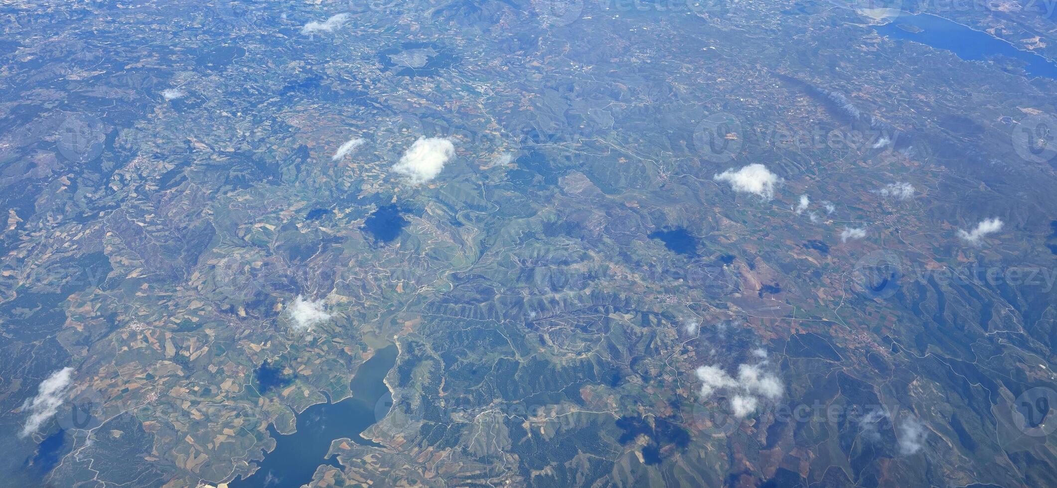 Aerial view of expansive landscape with clouds photo