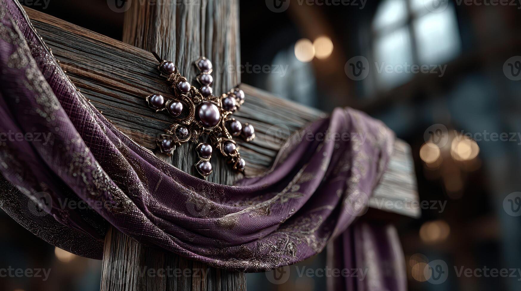 Intricate wooden cross adorned with fabric draping in an atmospheric, dimly lit interior setting with decorative elements photo