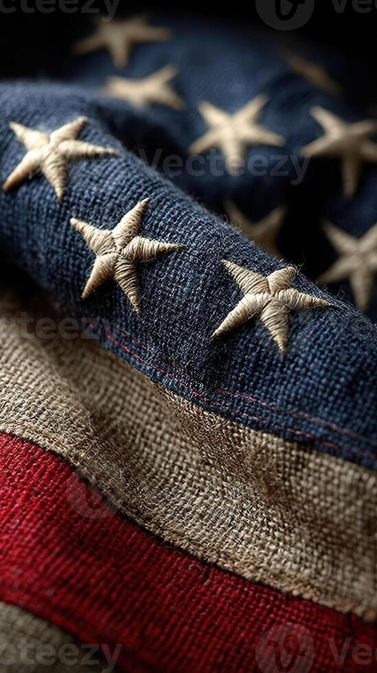 Textured American flag showcasing stars and stripes with intricate stitching in warm, natural lighting photo