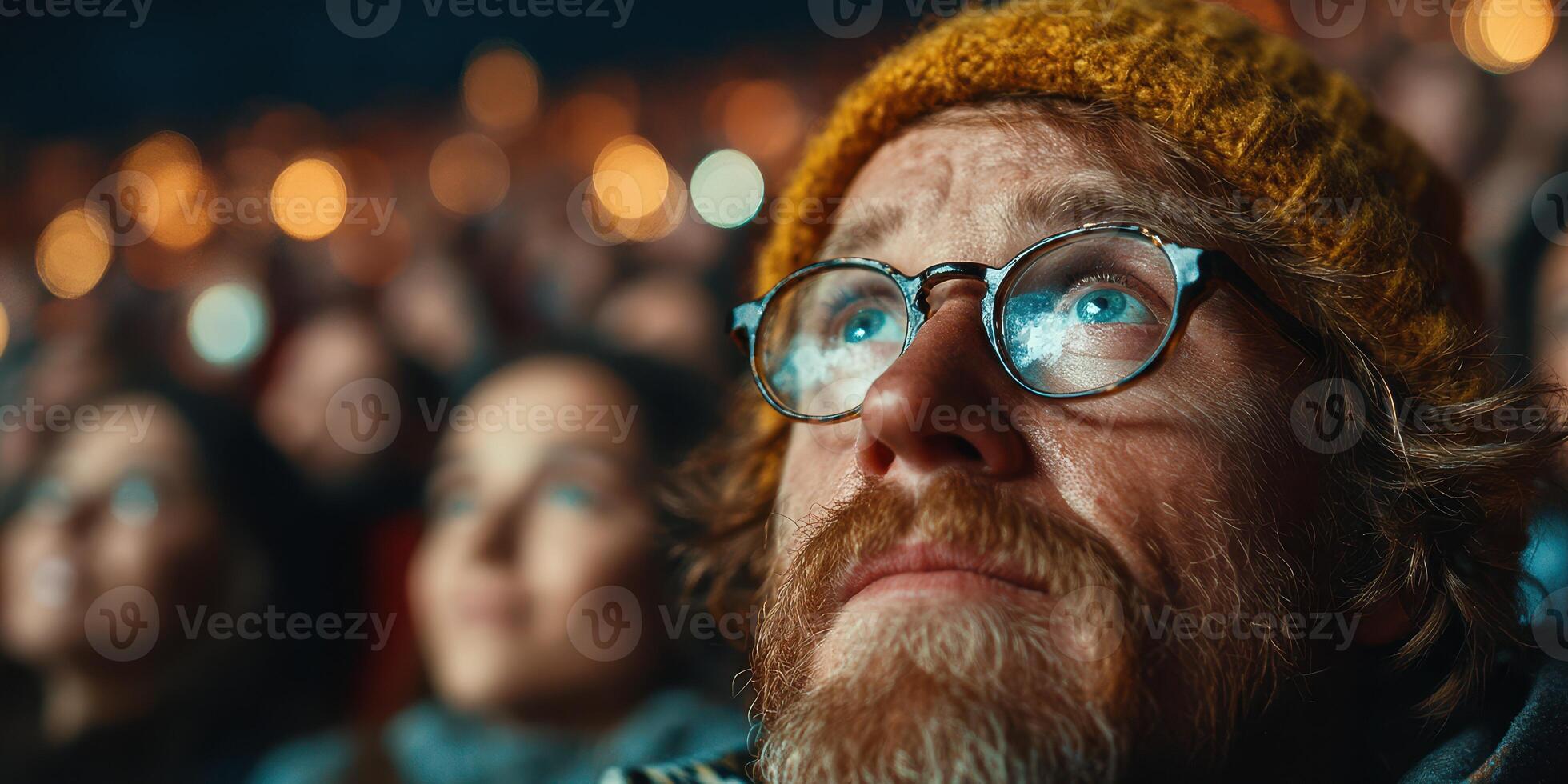 Watching an outdoor movie screening under the stars on a chilly evening photo