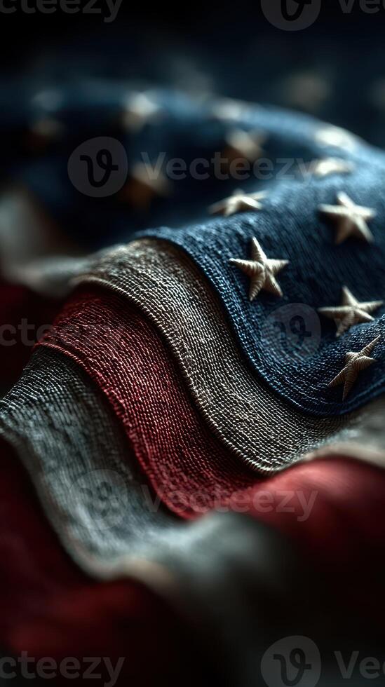 Textured American flag waves showcasing stars and stripes in dramatic lighting photo