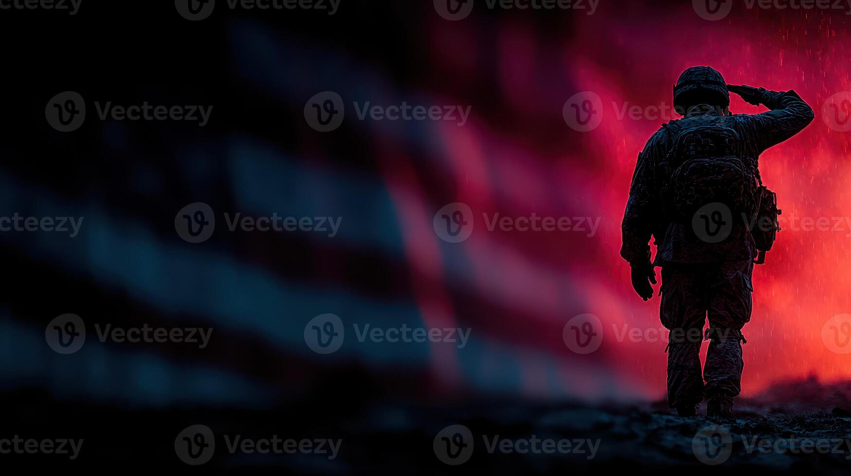 Soldier saluting against a fiery backdrop with an American flag in silhouette at night photo